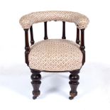 A VICTORIAN DESK CHAIR with upholstered horse shoe shaped back on turned supports, overstuffed
