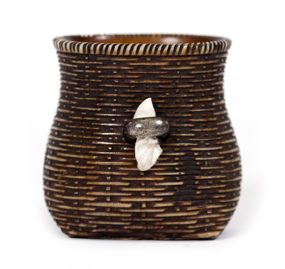 AN ANTIQUE JAPANESE NETSUKE in the form of a basket, with white metal clasp, 3.2cm high Condition: