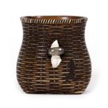 AN ANTIQUE JAPANESE NETSUKE in the form of a basket, with white metal clasp, 3.2cm high Condition: