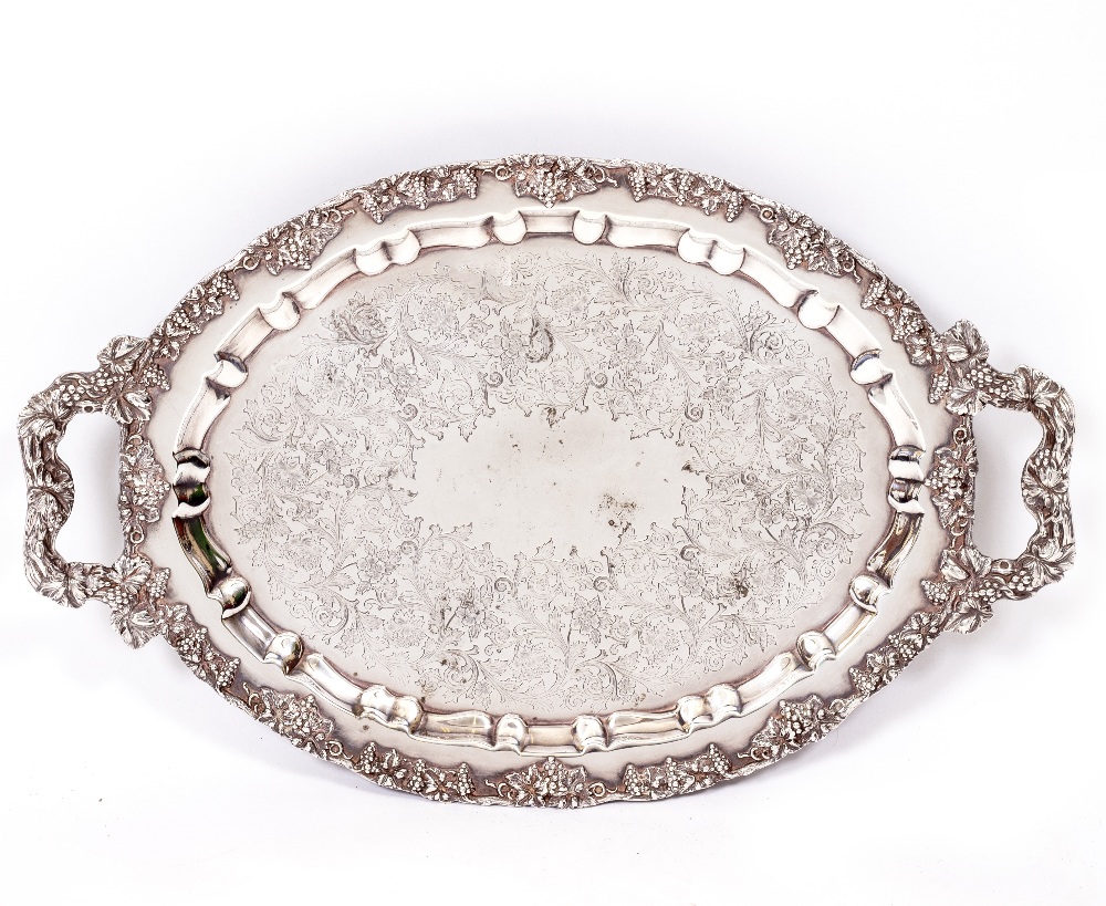 A MERIDEN BRITANNIA COMPANY SILVER PLATED TRAY with engraved decoration on a grapevine border,