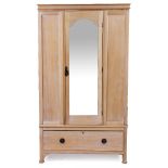 AN EARLY 20TH CENTURY PINE WARDROBE with a single mirrored door above one drawer, with square