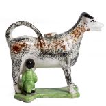 A LATE 18TH CENTURY PRATT WARE COW CREAMER mottled sponged brown and black decoration, 17cm wide x