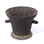 AN ANTIQUE FRENCH CAST IRON LARGE MORTAR with twin lugs and circular spreading base, 42.5cm diameter