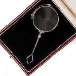A WHITE METAL PAIR OF SPECTACLES marked 525, inset with white stones encased in a red leather box At