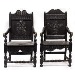 TWO ANTIQUE AND LATER EBONISED OAK WAINSCOTT STYLE ARMCHAIRS with carved panelled backs and turned