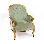 A LATE 19TH CENTURY GILDED UPHOLSTERED ARMCHAIR with scrolling arms and cabriole legs, terminating