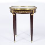 A 19TH CENTURY FRENCH LOUIS XVI STYLE CIRCULAR GILT BRASS MOUNTED MAHOGANY 'BOUILLOTTE' TABLE with