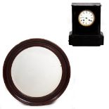 A CIRCULAR MAHOGANY FRAMED WALL MIRROR with bevelled glass, 65.5cm diameter and a late 19th