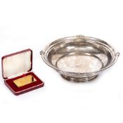 A SILVER BOWL with marks for Birmingham 1945, 23cm diameter x 7cm high together with a gold plated