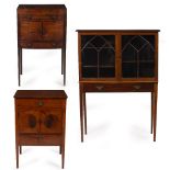 A GEORGE III MAHOGANY BOW FRONTED WASH STAND with a lifting top, two panelled doors and a single