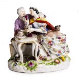 A LATE 19TH / EARLY 20TH CENTURY MEISSEN PORCELAIN FIGURAL GROUP a couple sharing wine, with blue