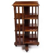A LATE 19TH / EARLY 20TH CENTURY MAHOGANY ROTATING BOOKCASE retailed by T.R. Scott, Dublin, 59cm
