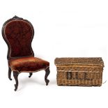 A VICTORIAN ROSEWOOD FRAMED UPHOLSTERED LOW CHAIR with scrolling cabriole front legs and ceramic