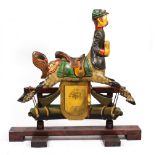 A PAINTED CARVED WOODEN CENTAUR ROCKING HORSE designed and carved by Robert L Chapman of Scartho