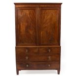 A 19TH CENTURY MAHOGANY LINEN PRESS with cupboard doors above two short and two long drawers, the