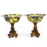 A PAIR OF MODERN CHINESE PORCELAIN AND CAST BRASS COMPORTS the yellow ground bowls decorated with