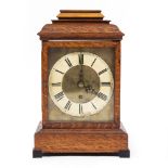 A LATE 19TH CENTURY OAK CASED BRACKET CLOCK with caddy top above a brass dial and single keyhole