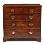 AN EARLY 19TH CENTURY MAHOGANY CHEST OF TWO SHORT AND THREE LONG DRAWERS standing on bracket feet,
