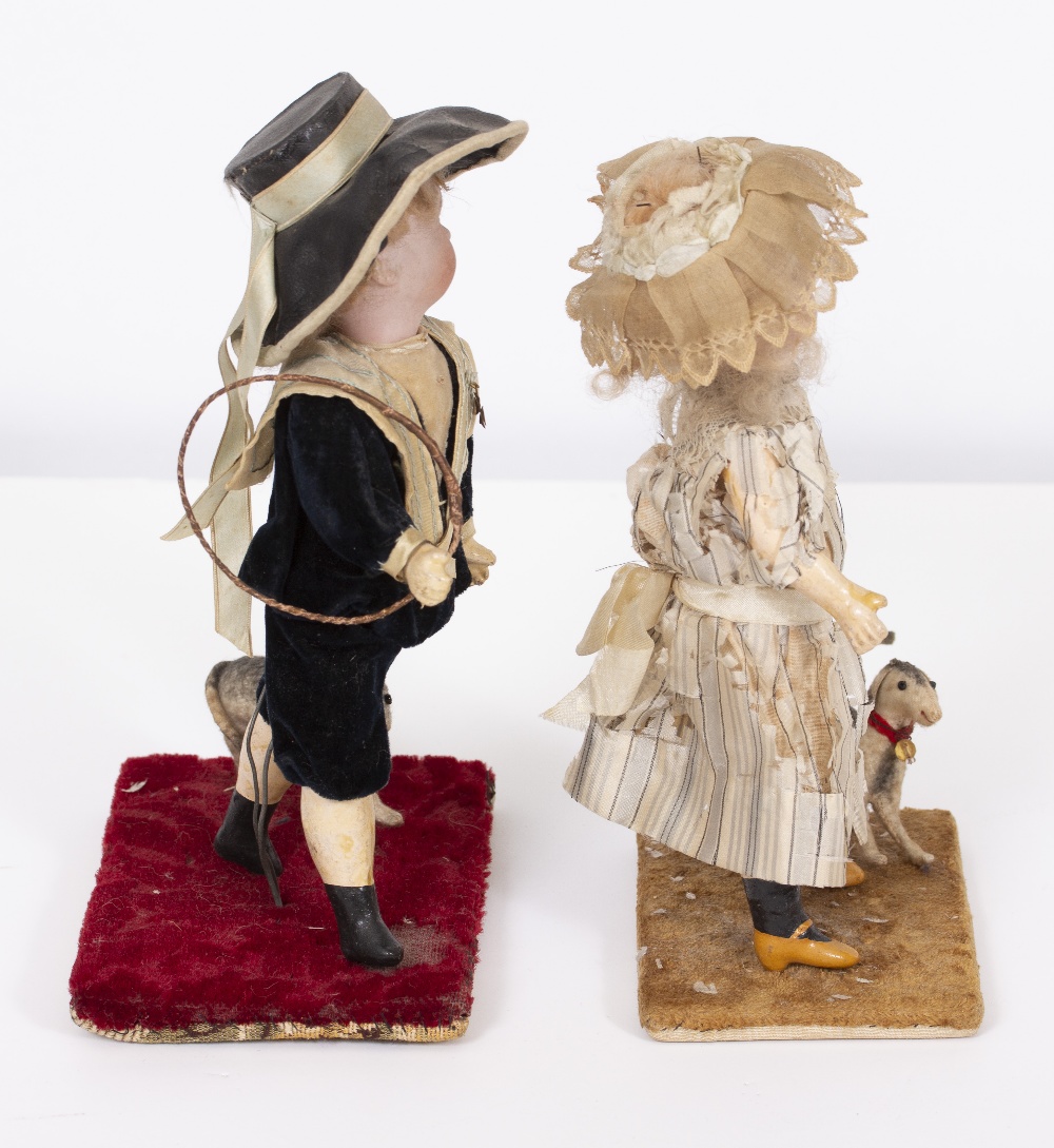 A PAIR OF VICTORIAN DOLLS a boy and a girl, each dressed in period costume and mounted on a - Image 6 of 7