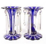A PAIR OF BOHEMIAN BLUE LAYERED GLASS LUSTERS each 13cm diameter x 20.5cm high Condition: some small