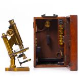 A LATE 19TH CENTURY CONTINENTAL STYLE MICROSCOPE by R & J Beck Limited of London numbered 20939 (