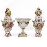 A PAIR OF CONTINENTAL PORCELAIN POTPOURRI VASES AND COVERS the vases decorated with classical