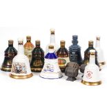 ELEVEN CERAMIC WHISKEY DECANTERS to include Bells Royal Reserve, Bells Christmas 1991, 1992, 1994,