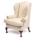 A 19TH CENTURY OR LATER WING BACK CHAIR with cabriole front legs and turned feet, 90cm wide x