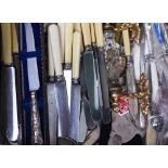 A MIXED COLLECTION OF CUTLERY to include silver handled butter knives, silver handled boot hook, a