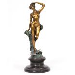 A GILDED BRONZE FIGURE OF A FEMALE NUDE on a turned hardstone socle, 25cm in height At present,