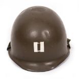 AN AMERICAN STYLE GREEN PAINTED MILITARY TIN HELMET the rim stamped B855R3, 23.8cm wide Condition: