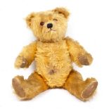 A MID 20TH CENTURY MUSICAL TEDDY BEAR 40cm in length Condition: some small tears to the pads, wear