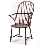 A WINDSOR SPINDLE BACK ARMCHAIR with carved saddle seat, 58cm wide x 103cm high At present, there is