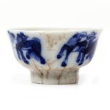 AN ANTIQUE CHINESE BLUE AND WHITE CRACKLE GLAZE MINIATURE BOWL decorated with horses, 5cm diameter x