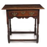 A GEORGE III OAK SIDE TABLE with a single frieze drawer, brass swan neck handles, turned supports