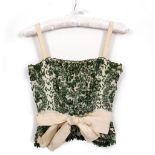 A CHRISTIAN DIOR OF LONDON LIMITED GREEN BEADED BONED TOP with zip back, the label numbered 29087