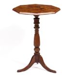 AN OCTAGONAL OCCASIONAL TABLE with specimen wood parquetry inlaid top on a turned column support and