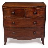 A SMALL SIZE 19TH CENTURY MAHOGANY BOW FRONTED CHEST OF TWO SHORT AND TWO LONG DRAWERS with turned