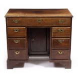 AN EARLY 18TH CENTURY STYLE MAHOGANY KNEEHOLE DESK 90cm wide x 50cm deep x 75.5cm high Condition: