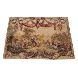 A MACHINE WOVEN TAPESTRY STYLE PANEL depicting figures in a farmyard beneath a floral tied swag,