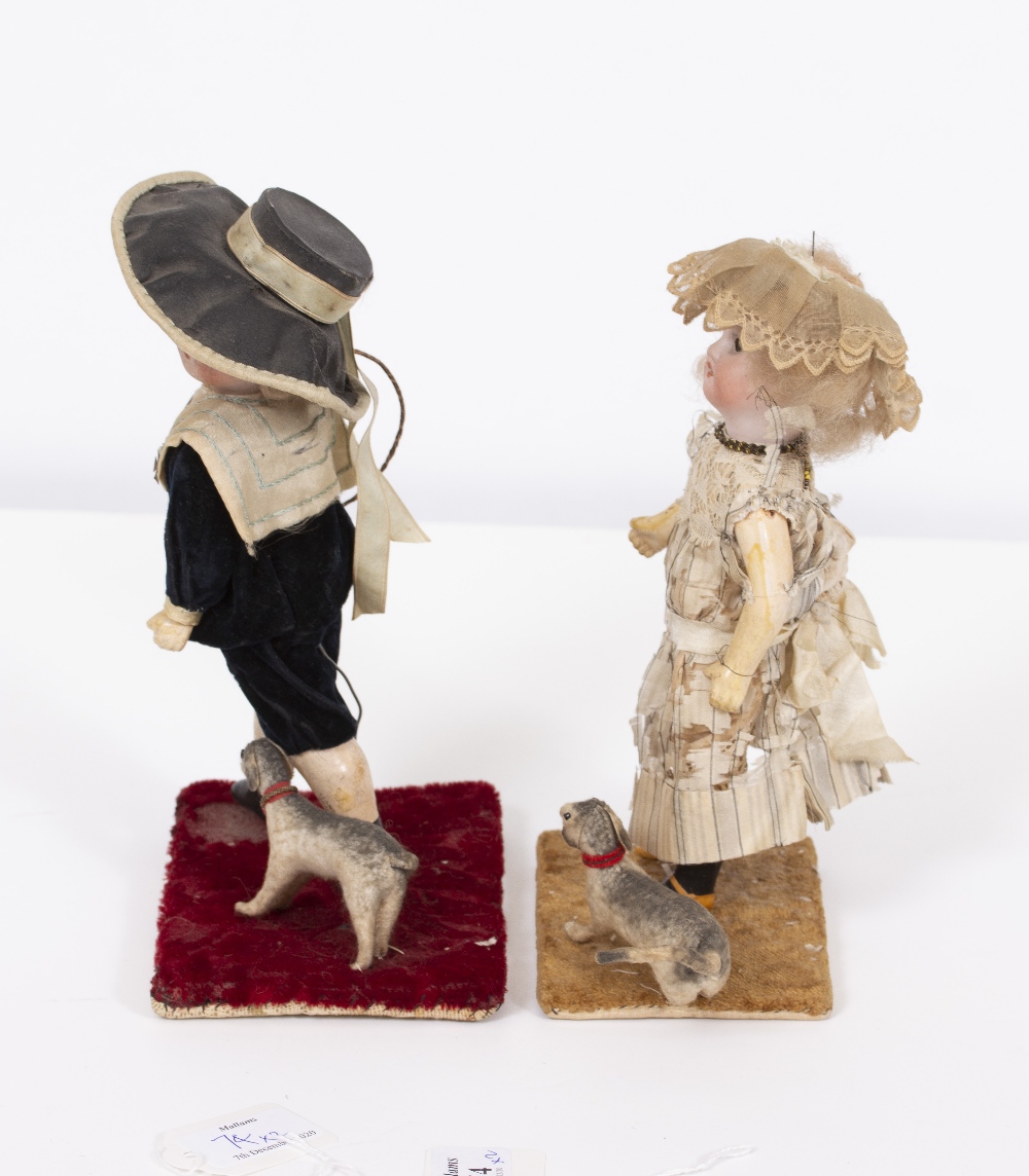 A PAIR OF VICTORIAN DOLLS a boy and a girl, each dressed in period costume and mounted on a - Image 7 of 7