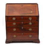 A GEORGE III MAHOGANY AND SATINWOOD CROSS BANDED BUREAU the fall front opening to reveal drawers and