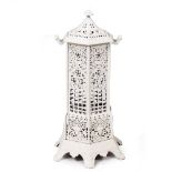 A 20TH CENTURY PAINTED CAST IRON CONSERVATORY HEATER of hexagonal form with pierced decoration, 45cm