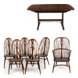 A SET OF SIX ERCOL DINING CHAIRS with swan pierced splats, consisting of a Windsor type armchair