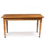 A HANDMADE RECTANGULAR KITCHEN TABLE possibly in chestnut with turned tapering legs and signed