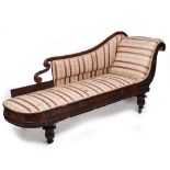 A WILLIAM IV ROSEWOOD FRAMED UPHOLSTERED CHAISE LONGUE with turned legs and later roller casters,