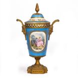 A SEVRES STYLE PORCELAIN POTPOURRI VASE AND COVER on a light blue ground decorated with floral