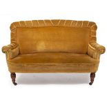 A LATE VICTORIAN WALNUT FRAMED UPHOLSTERED TWO SEATER SETTEE with turned legs and ceramic casters,