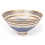 A PORCELAIN STUDIO POTTERY BOWL in the style of Mary Rich in blue and with gilt decoration and