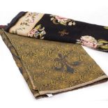 A SMALL NEEDLEWORK CARPET OR RUG of black ground with floral sprays within a floral border, 170cm